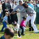 President Barack Obama and first lady Michelle Obama cheer on children taking part in an egg-rolling race as part of the White House Easter Egg Roll on the South Lawn of the White House April 1, 2013.
SAUL LOEB/AFP/Getty Images